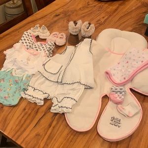 Girls newborn clothing and infant seat liner.
